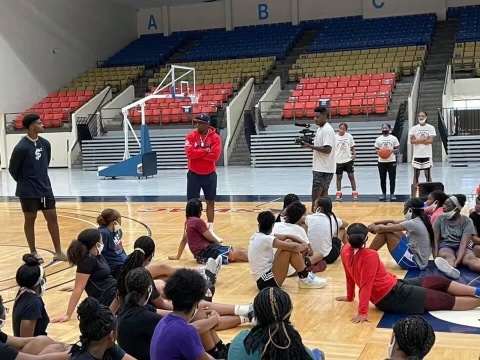 Coach Prime speaks to players at Coach Reed's elite basketball camp