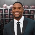 Michael Strahan donates helmets to his alma mater