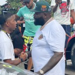 Rick Ross chops it up with Rajah Caruth ahead of race