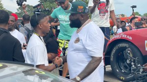 Rick Ross chops it up with Rajah Caruth ahead of race