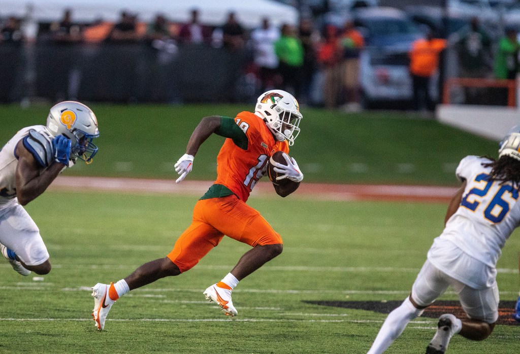 Xavier Smith of FAMU is on the run after a reception.