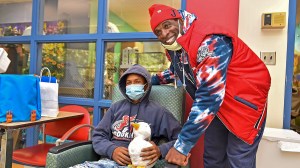 Deion Sanders delivers gifts to children battling serious illness