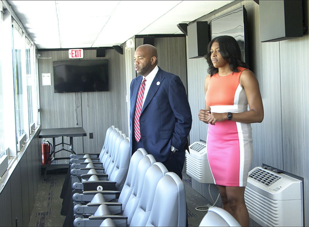 Faison and Rich peer out from the HBCU president's box of the stadium at Edward Waters.