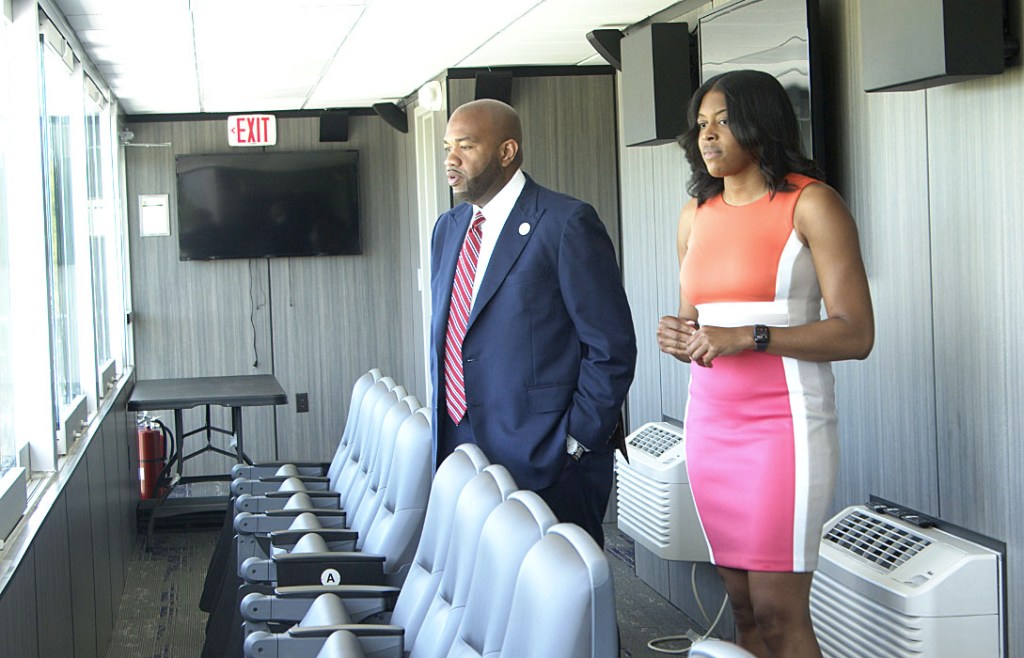 Faison and Rich peer out from the HBCU president's box of the stadium at Edward Waters.