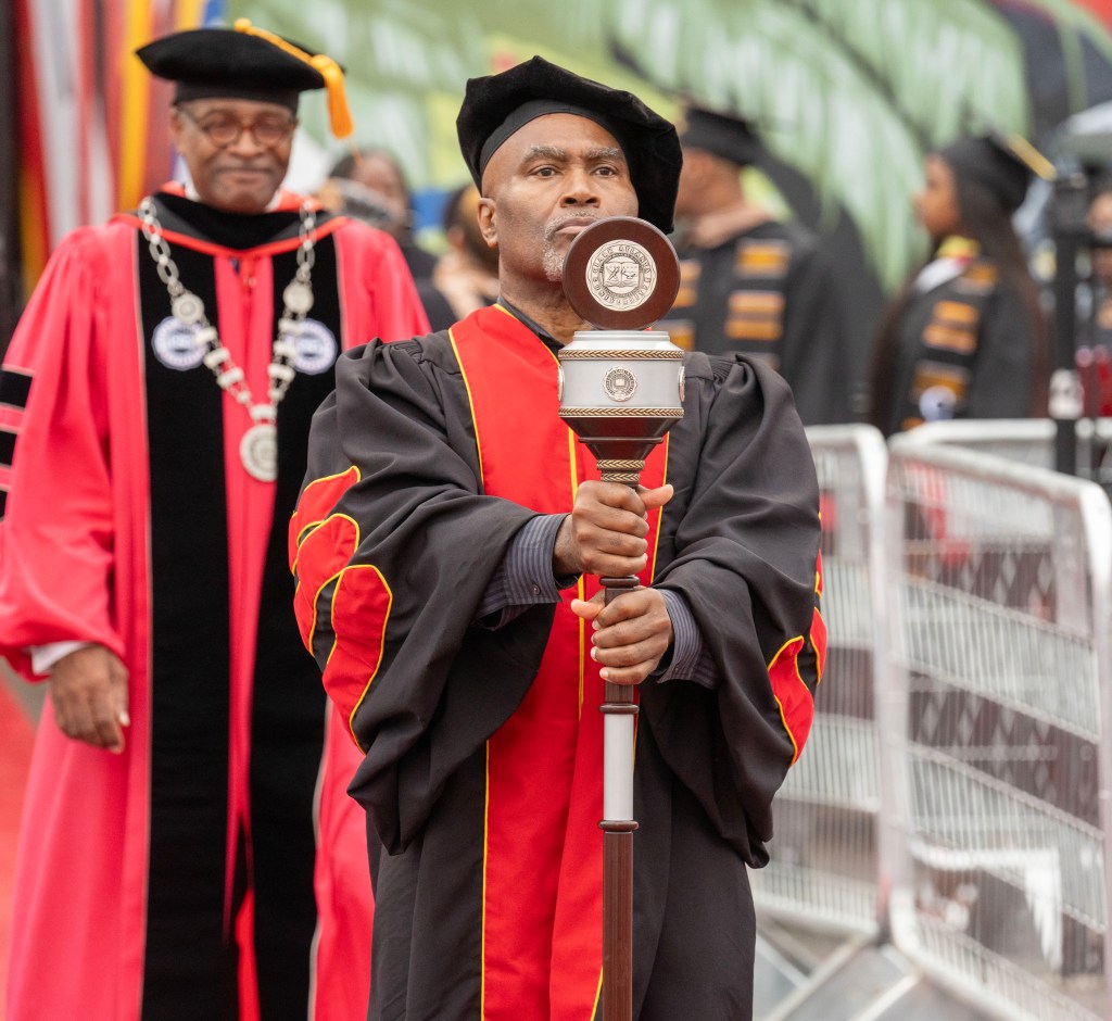 Dr. Daniel Black performed mace bearer duties before delivering the address.
