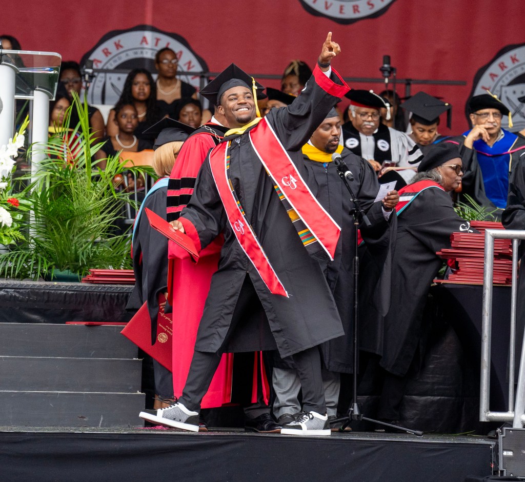 Kyle Anderson crosses the stage at CAU graduation