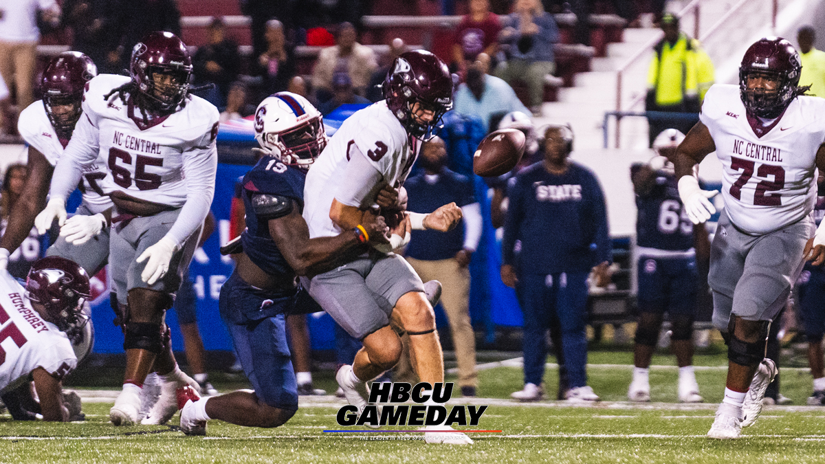South Carolina State defenders jar the ball from North Carolina Central quarterback Walker Harris' hands. (Steven J. Gaither/HBCU Gameday)