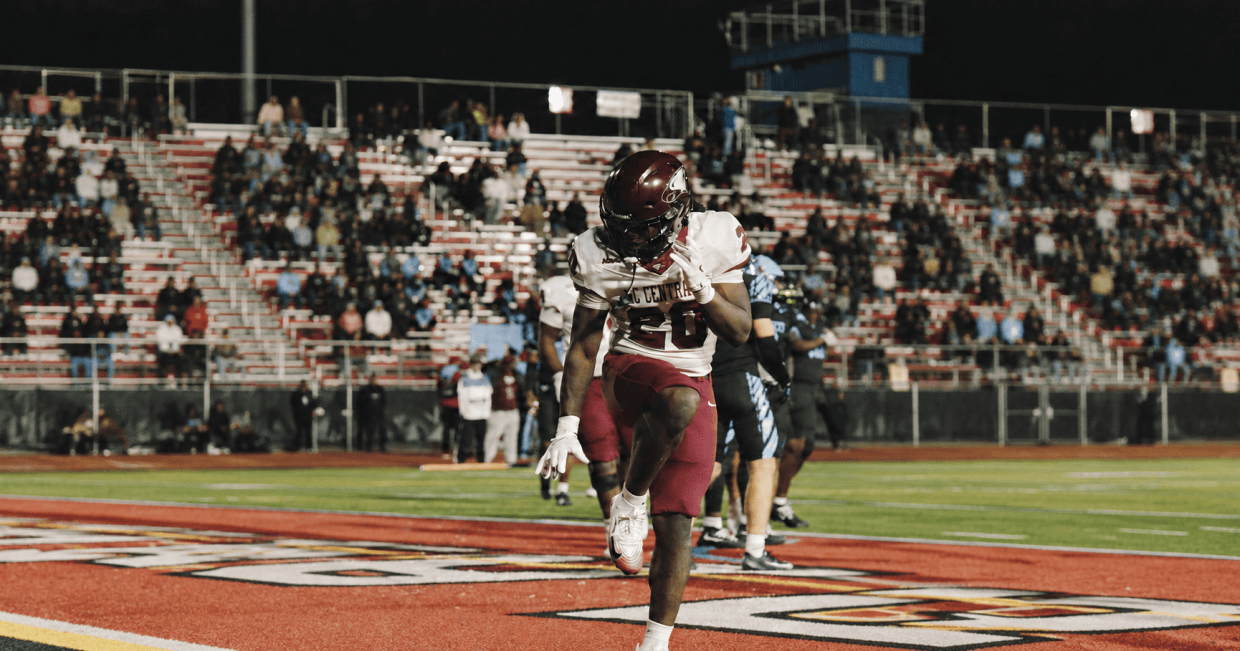Gino Addison carries the ball against Delaware State in Dover. Use only if the photograph depicts Addison.