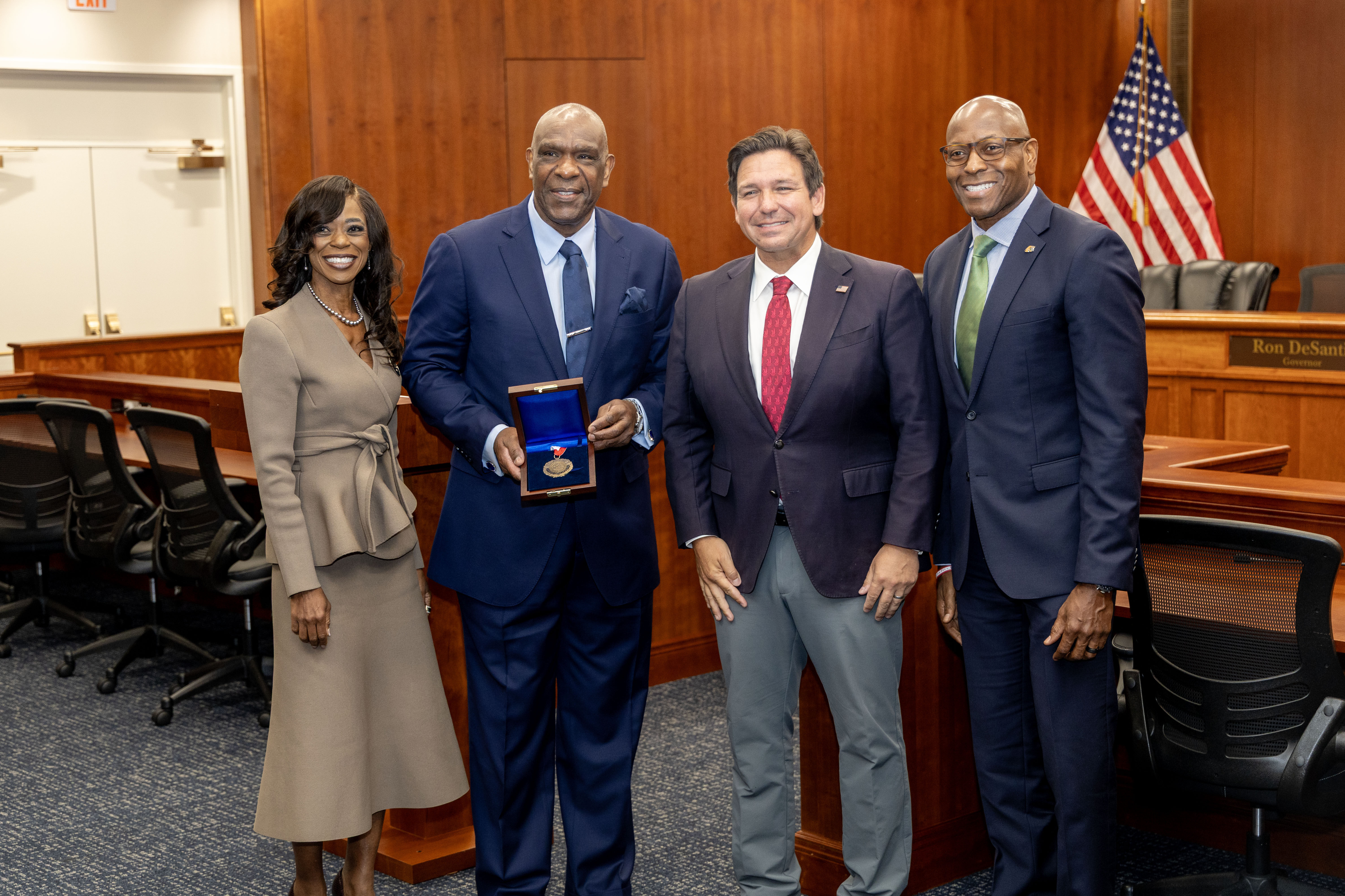 Andre Dawson Is Flankedu By PResident Marva Johnson Governor Ron DeSantis And AD John Davis