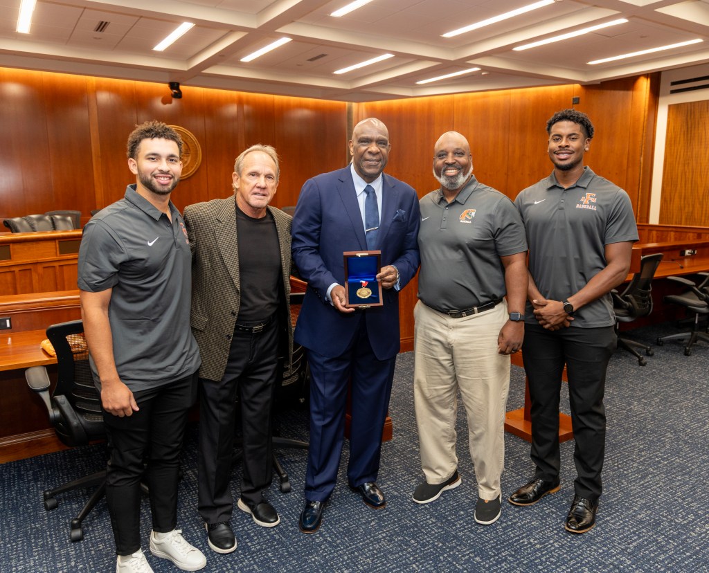 FAMU Baseball Coaches Jamey Shouppe And FAMU Players Pose With Andre Dawson